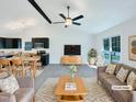 Staged living room featuring vaulted ceilings, modern furnishings, and a seamless open floor plan at 1405 Cross Link Rd, Raleigh, NC 27610