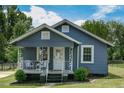 Cozy single-story home with a welcoming front porch and a well-kept yard at 1542 Albright Ave, Burlington, NC 27215