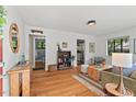 Inviting living room boasts hardwood floors, neutral paint, and an open floorplan offering seamless transitions to the kitchen and bathroom at 1804 N Alston Ave, Durham, NC 27701