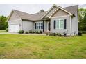 Attractive single-Gathering home showcasing manicured lawn, an attached garage, and tasteful landscaping at 201 Lexington Park Dr, Oxford, NC 27565