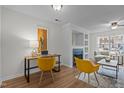 Comfortable living room with a work area, a fireplace, and hardwood floors at 206 Black Bird Ct, Cary, NC 27511