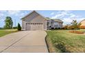 Beautiful home featuring manicured lawn, lovely landscaping, and a large driveway for easy access at 25 Cornfield Ln, Benson, NC 27504