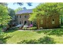 Charming two-story brick home with a well-manicured lawn and landscaped garden at 2901 Hunters Bluff Dr, Raleigh, NC 27606