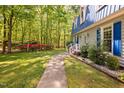Landscaped front yard with a sidewalk leading to the home's entryway at 3312 Shannon Cir, Apex, NC 27539