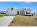 Beautiful single-Gathering home with manicured lawn, two-car garage, and classic design at 367 Fenella Dr, Four Oaks, NC 27524