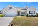 Well-maintained home featuring a two-car garage, landscaped yard, and inviting entrance at 367 Fenella Dr, Four Oaks, NC 27524