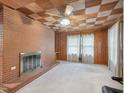 Spacious living room with cozy fireplace and unique wood ceiling at 3806 Sue Ln, Raleigh, NC 27604