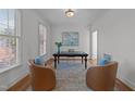 Home office with hardwood floors, natural light, and comfortable seating, ideal for working from home at 5016 Dillswood Ln, Raleigh, NC 27606