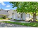 Well-kept single-story home with light blue siding, bay window, and tidy landscaping at 611 Edenberry Dr, Durham, NC 27713