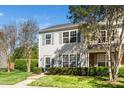Pleasant home with green shutters surrounded by trees and beautiful landscaping, providing a serene setting at 614 Canyon Lake Cir, Morrisville, NC 27560