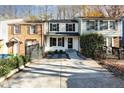 View of the home's exterior and a concrete driveway leading to the townhome at 7324 Summerland Dr, Raleigh, NC 27612
