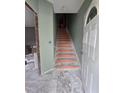 Welcoming entryway featuring a staircase and doorway, offering a glimpse into the home's layout at 827 Sunset Ave, Rocky Mount, NC 27804