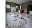 Living room under renovation featuring a fireplace, windows, and ample space at 827 Sunset Ave, Rocky Mount, NC 27804