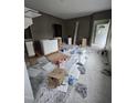 Living room under renovation featuring fresh paint, cabinet installs, and doorway access at 827 Sunset Ave, Rocky Mount, NC 27804