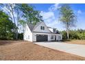 Beautiful home with a long drive leading up to the attached two car garage at 9200 Otter Ct, Middlesex, NC 27557
