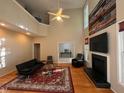 Spacious living room featuring a fireplace, vaulted ceiling, and comfortable seating at 105 Dairy Ct, Chapel Hill, NC 27516