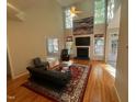 Bright living room with a fireplace, vaulted ceiling, and stylish furniture at 105 Dairy Ct, Chapel Hill, NC 27516
