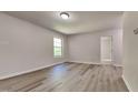 Bright bedroom featuring neutral walls, modern floors, and a sunlit window at 109 Stone Ridge Dr, Smithfield, NC 27577