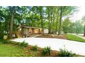 Beautiful brick home with manicured lawn and mature trees giving it a gorgeous curb appeal at 1124 Hardimont Rd, Raleigh, NC 27609