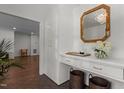 Elegant foyer with a chic console table, decorative mirror, and stylish patterned flooring at 1310 Mayfair Rd, Raleigh, NC 27608