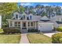 Beautiful two-story home with a covered porch and well-maintained landscaping at 1420 Willowleaf Way, Apex, NC 27502