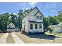 Beautiful new home showcases a well-manicured lawn and stylish architectural details at 1448A Maplewood Dr, Durham, NC 27704