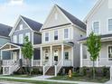 Inviting two-story home with light gray siding and a cozy front porch at 1517 Millrock Trl, Wendell, NC 27591