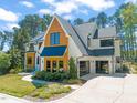 Charming two-story home with a modern farmhouse design and a three car garage at 1616 Hunting Ridge Rd, Raleigh, NC 27615