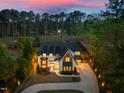 Beautiful exterior of the home with a well-manicured lawn and tall trees, offering privacy and curb appeal at 1616 Hunting Ridge Rd, Raleigh, NC 27615