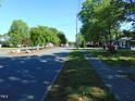 Quiet street view with mature trees and well-maintained sidewalks at 223 S Main St, Wendell, NC 27591