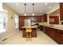 Spacious kitchen with stainless steel appliances, granite countertops and a center island at 2507 Princewood St, Raleigh, NC 27612