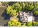 Breathtaking aerial view of the estate, showcasing the sprawling property, lush greenery, and lakefront access at 25303 Ludwell, Chapel Hill, NC 27517