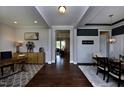 Elegant entryway showcasing dark hardwood floors, decorative accents, and a view into the living spaces at 33 Blackhorn Ct, Pittsboro, NC 27312