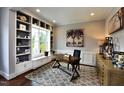 Bright office with custom built-ins, a large window seat, and a stylish work desk at 33 Blackhorn Ct, Pittsboro, NC 27312
