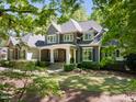 Charming two-story home features stone accents and a welcoming front porch at 3513 Forest Oaks Dr, Chapel Hill, NC 27514