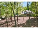 Stunning two-story home with lush surroundings and mature trees at 3513 Forest Oaks Dr, Chapel Hill, NC 27514