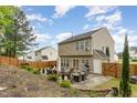 A spacious backyard featuring a patio area and a lush lawn, perfect for outdoor living at 406 Sapphire Dr, Durham, NC 27703