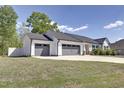 Lovely house shows three-car garage and well-maintained lawn at 42 Voyage Cir, Smithfield, NC 27577