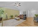 Open living room features vaulted ceilings and stylish decor at 42 Voyage Cir, Smithfield, NC 27577