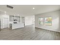 Bright and open floor plan with luxury vinyl plank flooring and plenty of natural light at 441 White Birch Ln # 66, Angier, NC 27501