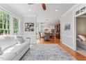 Open concept living room that seamlessly connects to the dining area and kitchen, great for entertaining at 4513 Touchstone Forest Rd, Raleigh, NC 27612