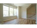 Bonus room with LVP flooring, crown moulding and multiple windows at 4517 Pale Moss Dr, Raleigh, NC 27606