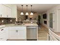 Modern kitchen with stainless steel appliances, granite countertops, and a breakfast bar at 505 Gooseneck Dr # B1, Cary, NC 27513