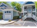 Charming two-story home with a garage, exterior staircase, and well-maintained landscaping at 511 Hillsborough St # 103, Chapel Hill, NC 27514