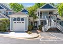 Charming two-story home with a garage, exterior staircase, and well-maintained landscaping at 511 Hillsborough St # 103, Chapel Hill, NC 27514