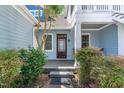 Inviting front porch with cozy seating area and well-maintained landscaping at entrance at 511 Hillsborough St # 103, Chapel Hill, NC 27514