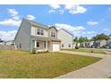 A beautiful home with a well-maintained lawn and a private driveway at 632 Hunters Ridge Dr, Fuquay Varina, NC 27526