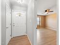 Light and bright foyer features wood-look floors and neutral paint, leading into the living spaces at 729 Golden Horseshoe Ln, Sanford, NC 27330