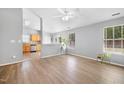 Bright living room with wood-look floors, neutral walls, and plenty of natural light at 729 Golden Horseshoe Ln, Sanford, NC 27330