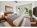 Comfortable bedroom with plush carpet, ceiling fan, and natural light from double hung windows at 7425 Silver View Ln, Raleigh, NC 27613